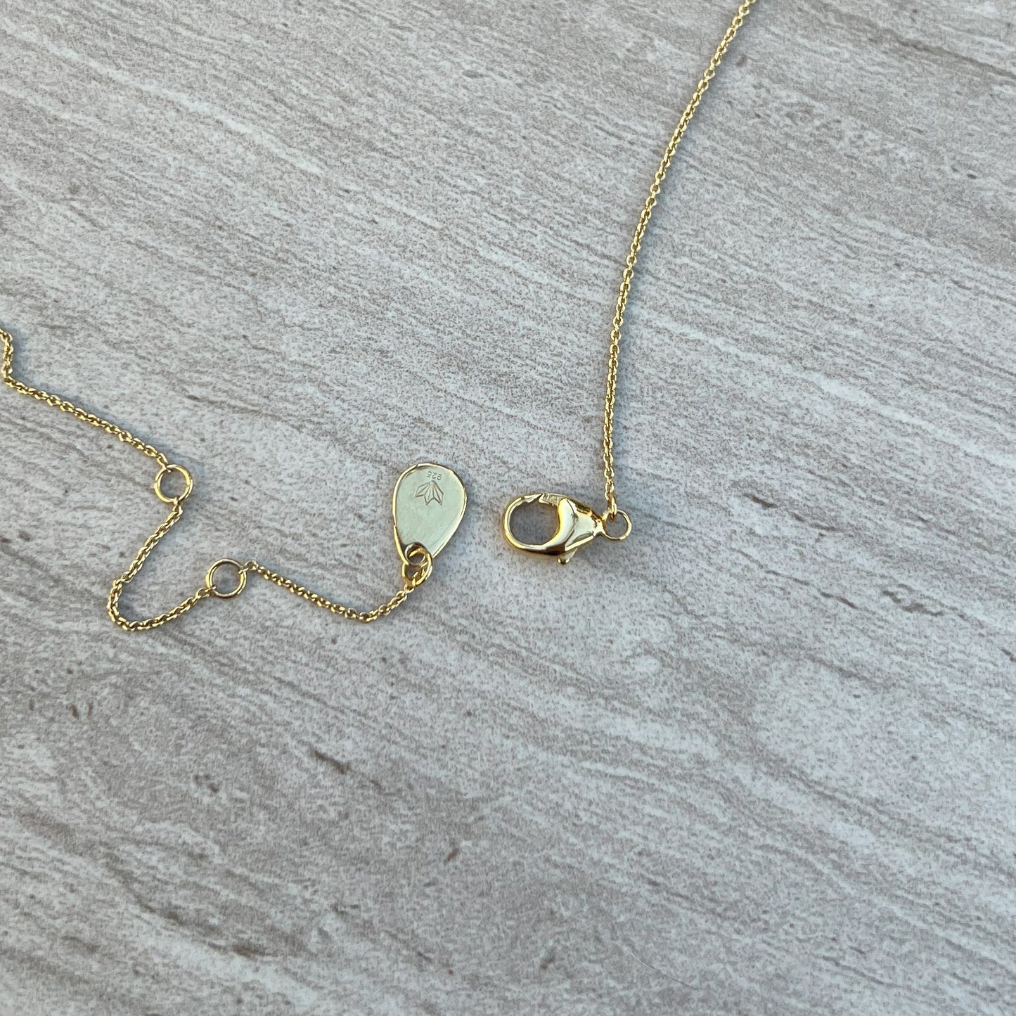 gold necklace clasp tag
