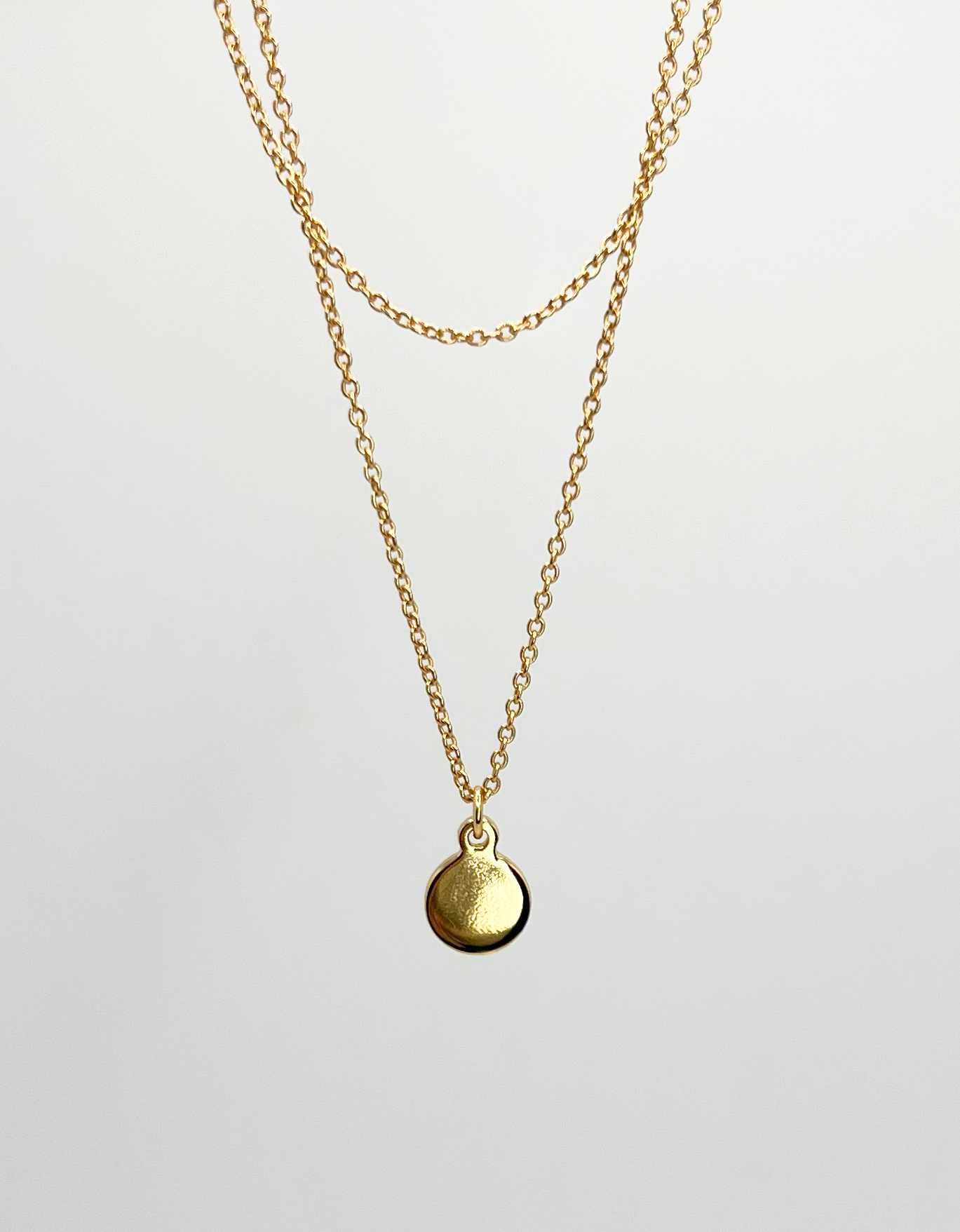 gold double layered necklace circle pendant hanging