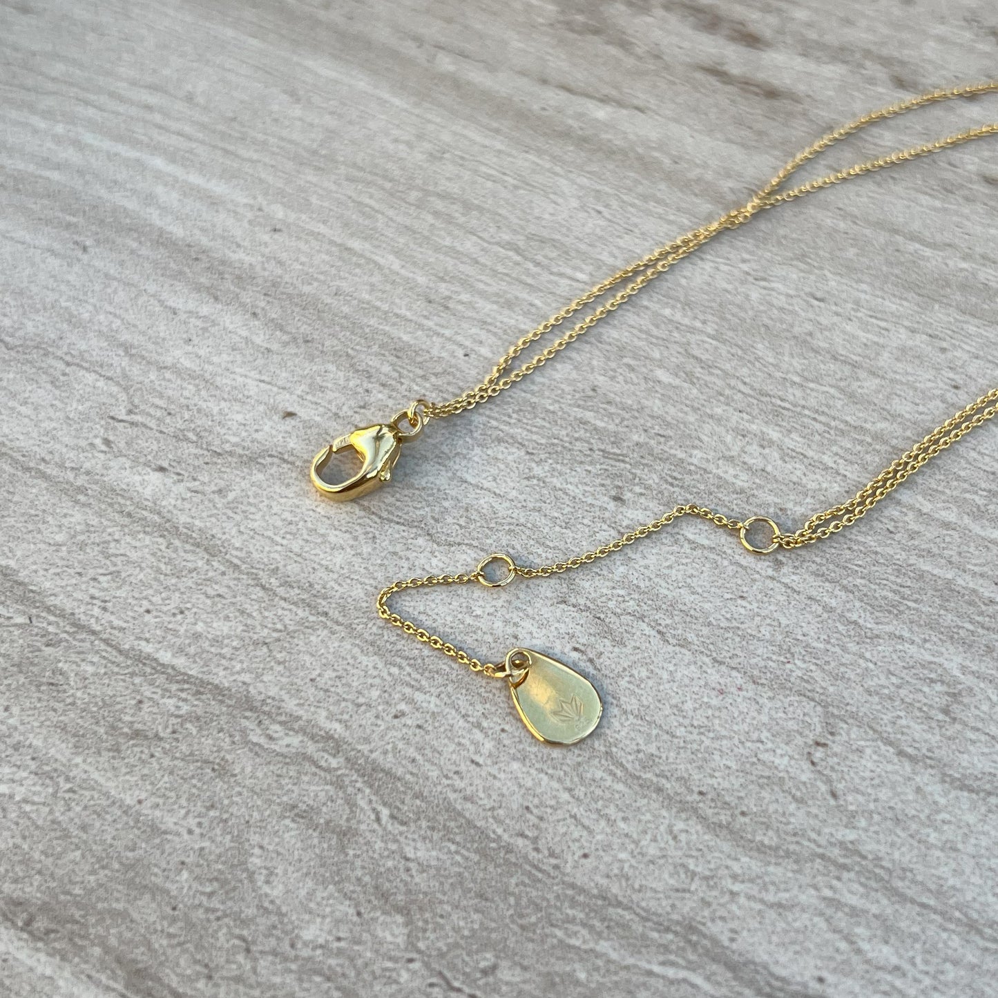 gold necklace clasp tag